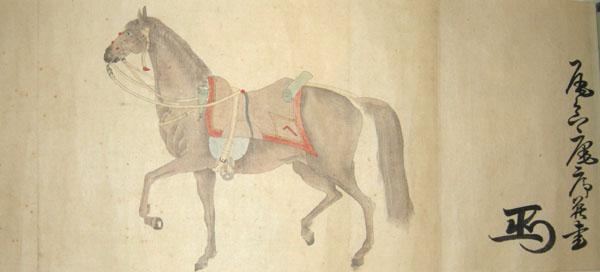巻物に馬が走っている様子が描かれた写真